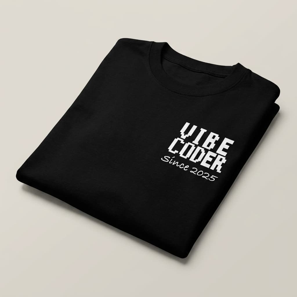 Folded view: Black t-shirt with a small left-chest print reading VIBE CODER, Since 2025